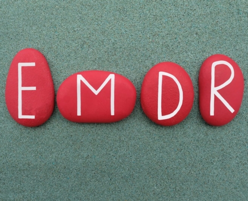 A close up of rocks with the letters emdr. Learn more about the benefits of EMDR therapy in Las Vegas, NV and search for EMDR in las vegas, ca. Or, search for an EMDR therapist in las vegas, nv.